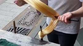 Almost like a magic show! Man makes long candy in an old town in Taiwan.