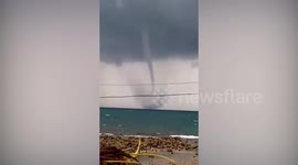 Waterspout tornado forms off the coast of the Philippines