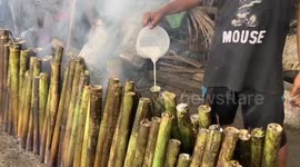 Traditional rice dish cooked in hollowed out bamboo served on roadsides in Indonesia