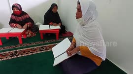 Indonesian people with visual impairments read Quran using braille system during Ramadan