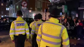 Police on patrol as Londoners swarm Soho on the first Saturday after lockdown eased