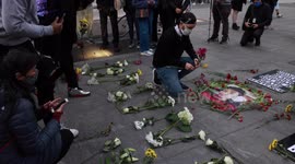 Demonstrators lay flowers at vigil for Daunte Wright and chant  'Say his name' in New York