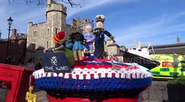 Knitted postbox topper is decorating a postbox outside Windsor Castle