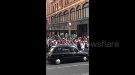 Massive crowd seen outside luxury department store Harrods in London on first weekend after lockdown eased