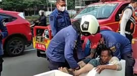 Indonesian firefighters rescue man stuck in concrete road barrier
