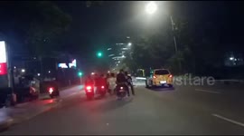 Funny Action of Youths Hand in Hand Using a Bench, Central Jakarta, Indonesia