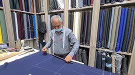 Indian tailor busy doing his work in Qatar