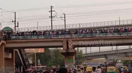 Masses of people in India rush to bus terminals in droves ahead of 6-day lockdown to curb COVID-19