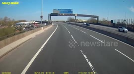 Road rage as car pushes a van onto the hard shoulder.