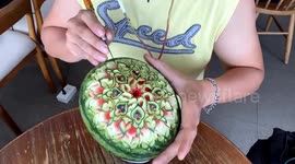 Vietnamese man carves heart flowers out of watermelon