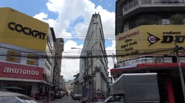 Bizarre thin building shaped like a slice of cheese in Bangkok