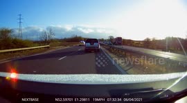 Police vehicles come to the rescue of a broken car on a busy road