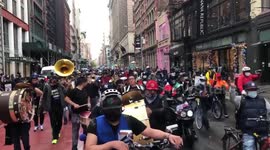 Pro-delivery worker demonstrators march in Manhattan