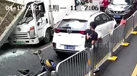 Security booth roof crushes truck cabin after being knocked down by the vehicle in southern China
