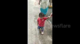 Terrifying moment toddler is saved by dad after falling down manhole