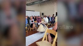 Flower girl steals hearts at a wedding by twirling and dancing down the aisle