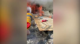 Modest hero praised for using a GARDEN HOSE to extinguish a fire