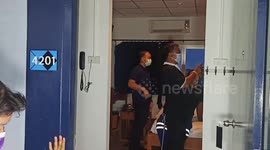 Hapless monitor lizard rescued getting stuck between two walls