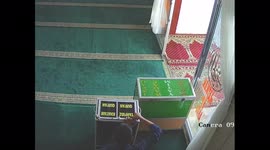 Thief caught on camera stealing money from charity boxes at church in Indonesia