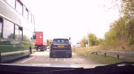 Dashcam Footage - Dangerous Driving - Bus Jumps Red Light / Bus Driver ignores traffic signal.