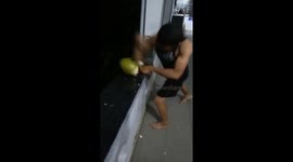 Vietnamese man uses elbow to smash open coconut in show of strength