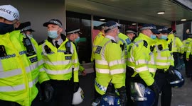 Police in riot gear move in at Kroneke Out protest at Emirates Stadium