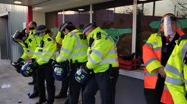 Police get into riot helmets at bottles continue to be thrown at Kroneke Out protest