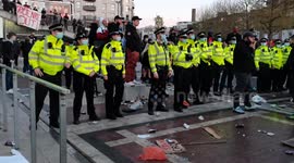 Police try to move protestors away from the front of the ticket offices at Kroneke Out Protest and are met with resistance