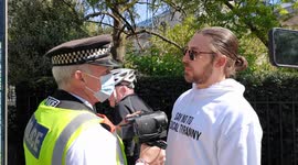 Heated confrontation between anti-lockdown protester and police officer in London