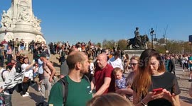 Young protesters have a raucous flash party In front of Buckingham Palace