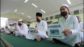 Indonesians pray for 53 crew members of missing submarine