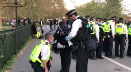 Police officer receiving medical treatment after being injured in Hyde Park during an anti-lockdown protest
