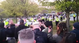Cop with bloodied face tries to calm crowd at London anti-lockdown protest