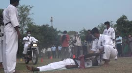 Karate master claims new record by allowing hundreds of motorbikes to ride over his chest
