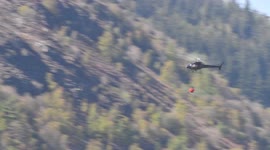 Dramatic video shows crew dousing a forest fire in the Lake District that saw nine engines and a helicopter called in to tackle the blaze