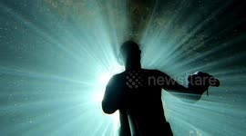 pov freediving in a cave with sunbeams underwater