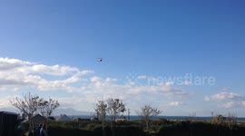 Irish Coast Guard Helicopter Rescue 115 coming into land on a local soccer pitch in the sea side village of Fenit Co Kerry