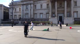 Skateboarder fails a barrier jump on Trafalgar Square