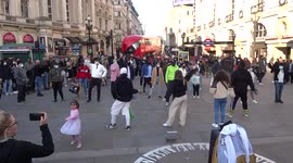Londoners enjoy dancing in the streets despite coronavirus pandemic - Piccadilly Circus Street Party