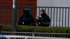 Armed police and bomb disposal attend Crawley College in Sussex following reports of gun shots being fired