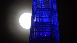 Supermoon filmed dramatically sitting above London's iconic Shard building
