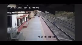 HIGH QUALITY VERSION: Dramatic moment heroic Indian railway worker risks life to save child from being crushed under train