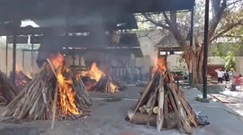 Locals watch funeral pyres in Delhi as COVID-19 deaths continue to surge