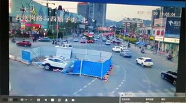 Car falls into deep hole after crashing through barriers in northern China