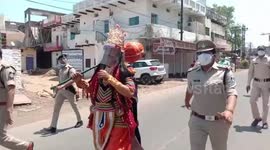 Man dresses up as Hindu god to spread awareness regarding COVID-19 in central India