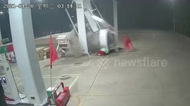 Truck smashes into petrol station in China as motorist suffers driver fatigue