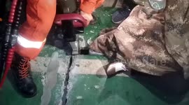 Chinese firefighters free girl's leg from hole in garage leading to sewer