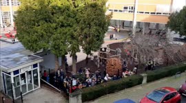 Belgian man performs epic metal concert on balcony for kids