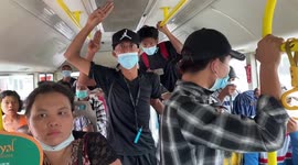 Anti-coup protesters in flashmob on public bus in Myanmar's largest city