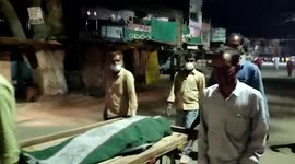 Relatives of deceased carry her body in hand-cart after being denied medical services in central India